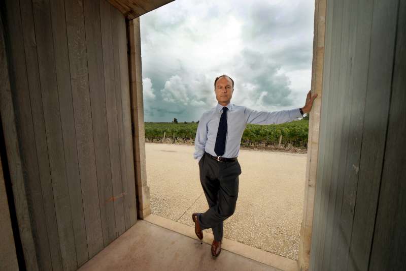 Frédéric Engerer is photographed at the exit of the store at Latour and in front of the vines. He is the intermediary between vine and bottle; Latour becomes what it is through him.